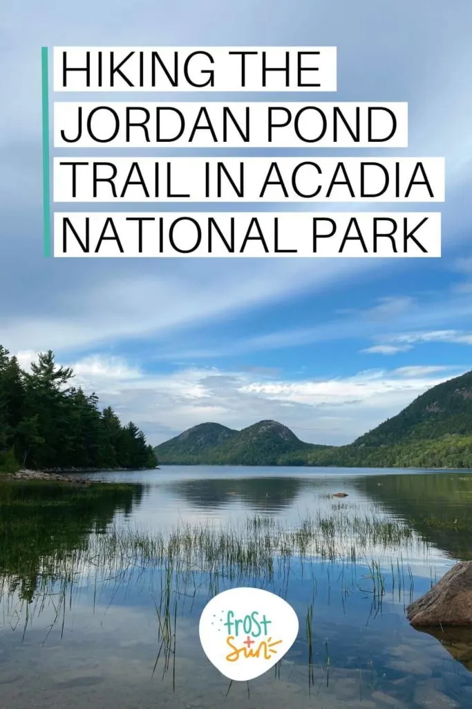 Photo of the Bubbles mountains reflecting in Jordan Pond. Text overlay reads "Hiking the Jordan Pond Trail in Acadia National Park."