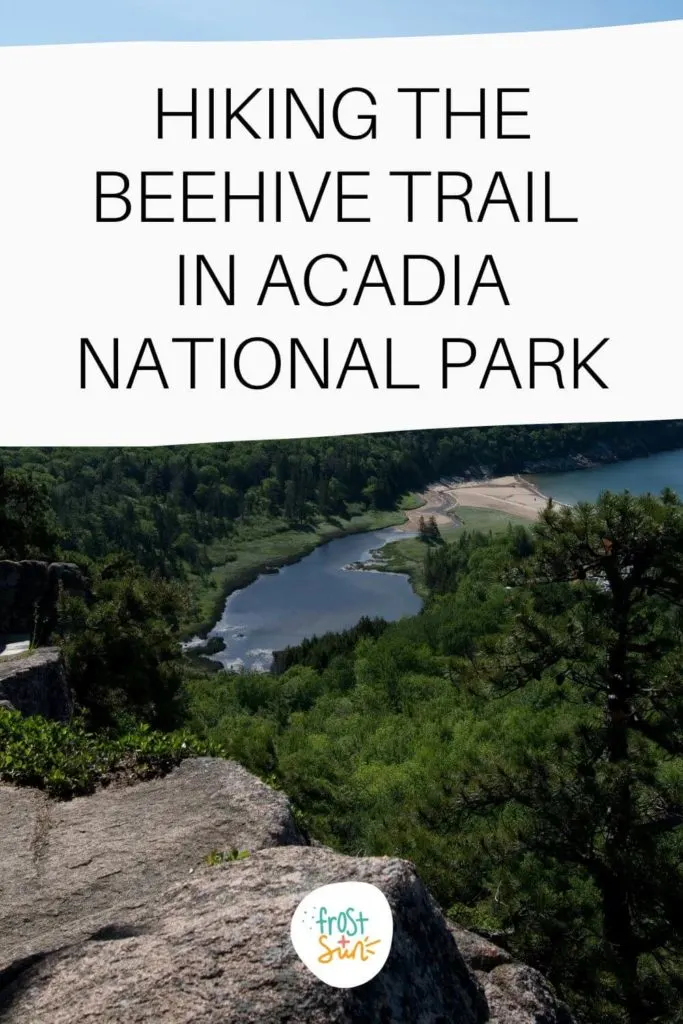 Photo of the view from atop the Beehive Hike with Sand Beach below and lush green trees. Text overlay reads "Hiking the Beehive Trail in Acadia National Park."