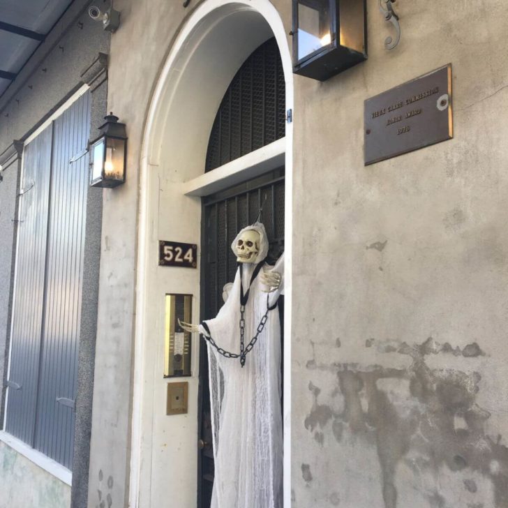 Photo of a ghost prop chained to a door in the French Quarter.