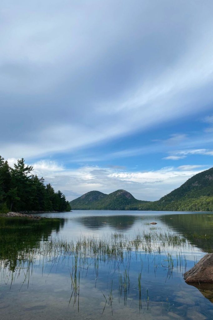 Photo of the Bubbles mountains reflecting in Jordan Pond.