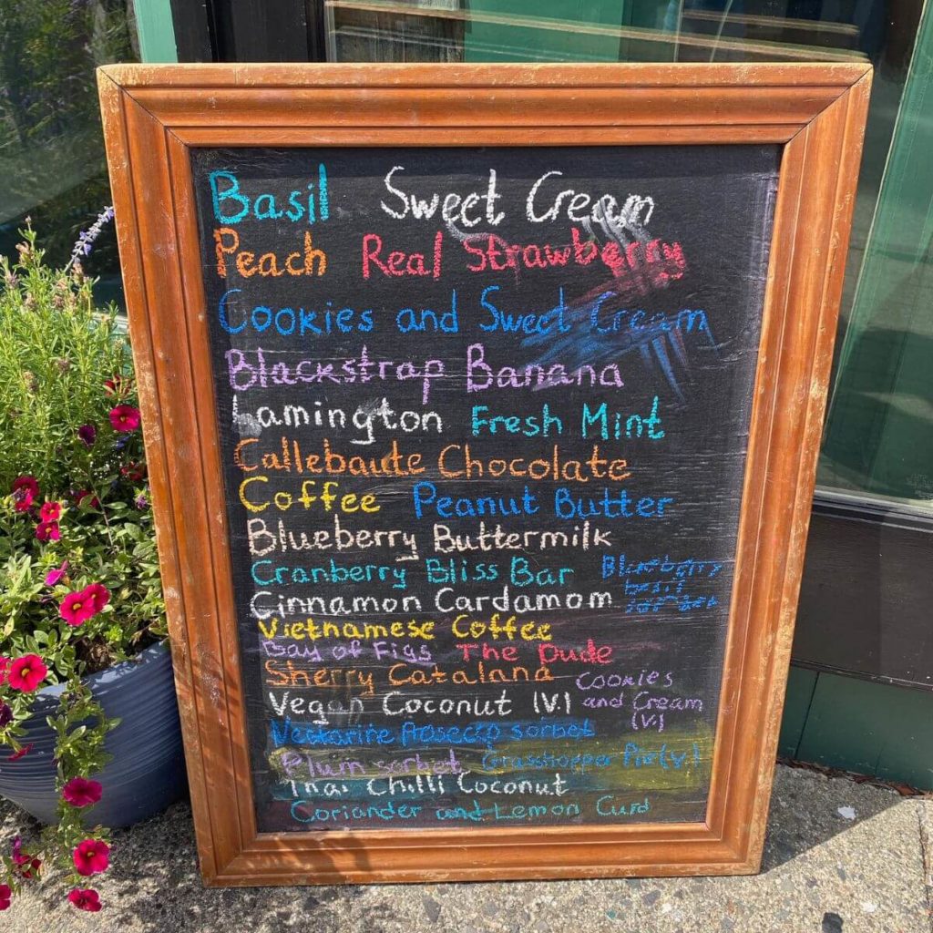 Photo of a chalkboard with ice cream flavors outside the Mount Desert Island Ice Cream shop.