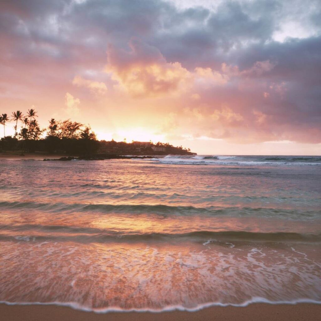 Photo of Poipu Beach Park on the island of Kauai at sunrise.