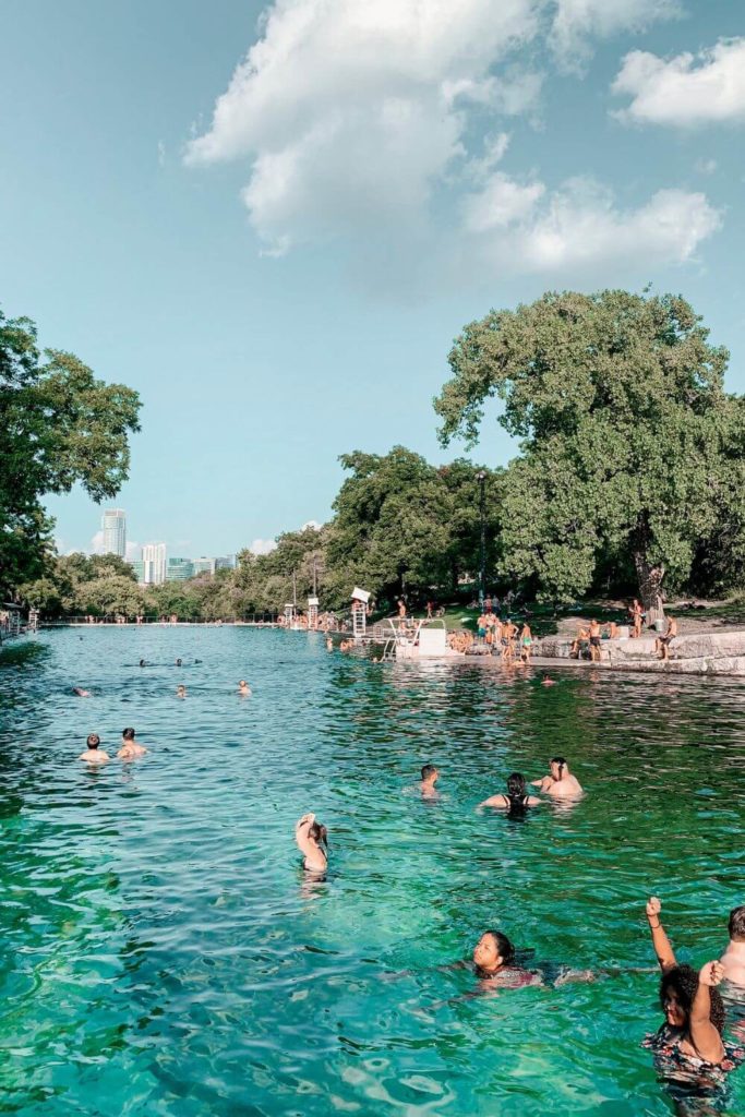 Photo of people swimming at Barton Springs in Austin, TX.