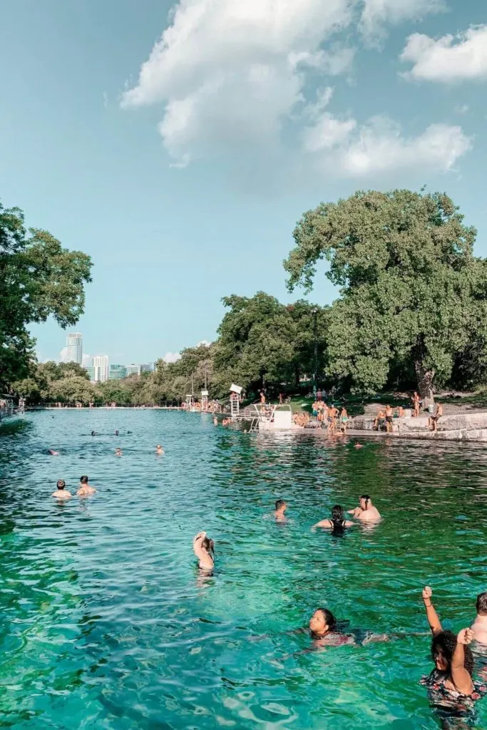 Photo of people swimming at Barton Springs in Austin, TX.