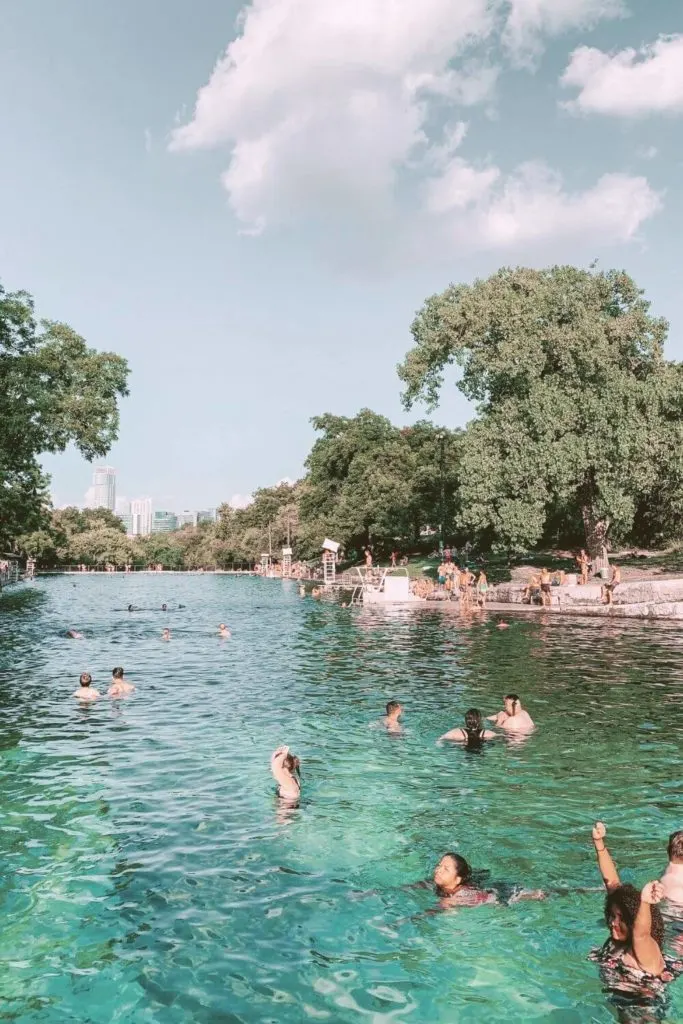 Photo of people enjoying Barton Springs Pool.