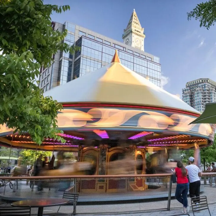 Photo of the Greenway Carousel in Boston in motion.