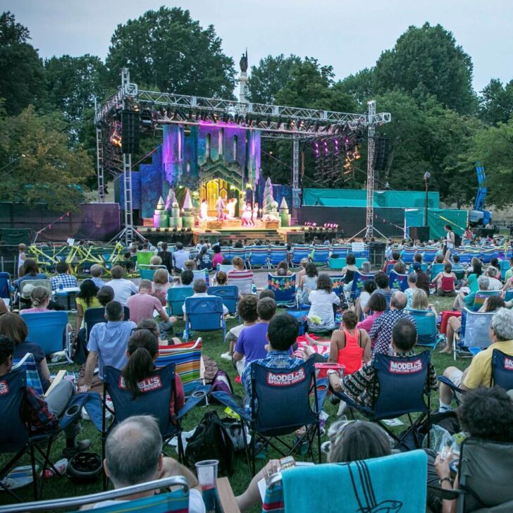 Photo of the Commonwealth Shakespeare Company performing on stage on Boston Common.