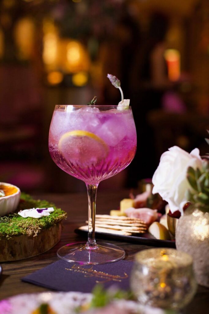 Photo of the violet hued Giggy Tonic from Vanderpump Cocktail Garden at Caesars Palace.