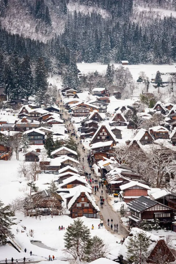 Photo of a snowy Japanese village from above.