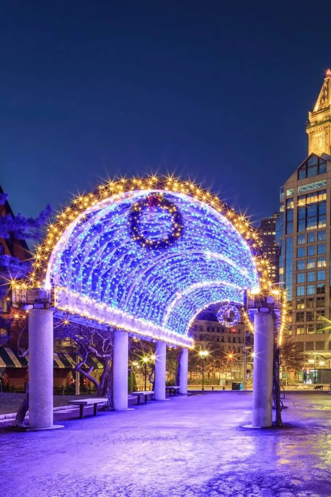 Photo of the Christopher Columbus Trellis at night in Boston's North End with Christmas lights turned on.