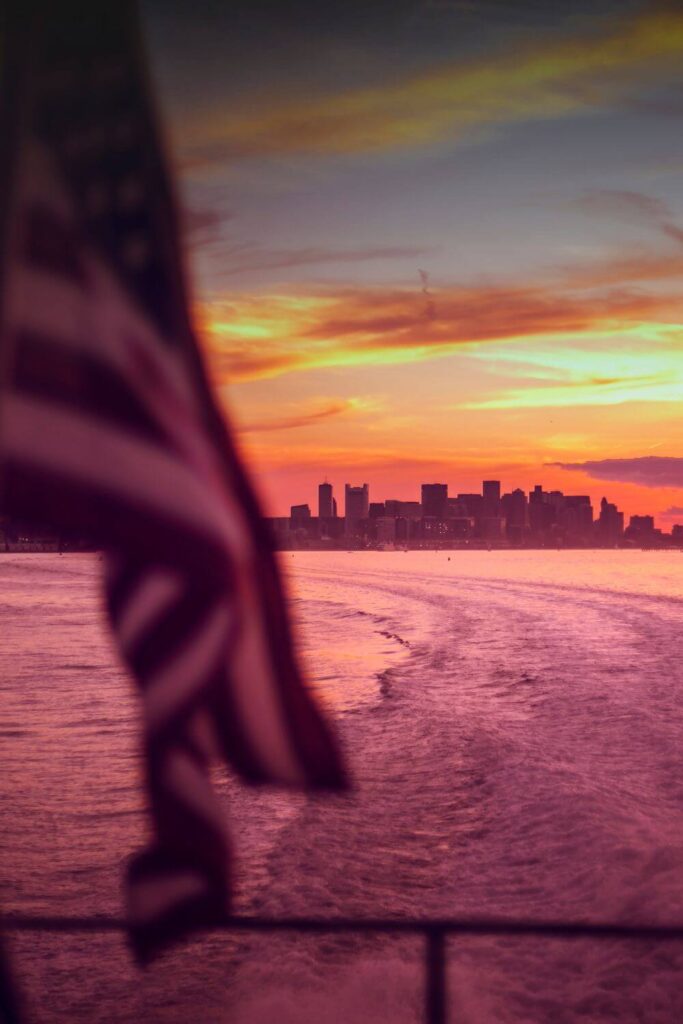 Photo from a boat looking out over the wake in the Boston Harbor.