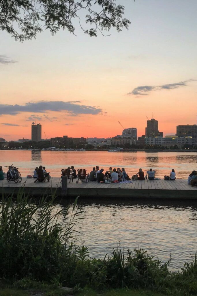Photo of the Cambridge skyline from the Charles River Esplanade in Boston during sunset.