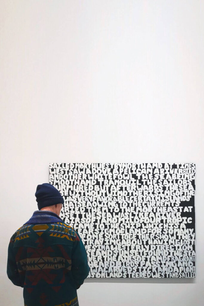 Photo of a person admiring a contemporary art piece at a museum in Boston.