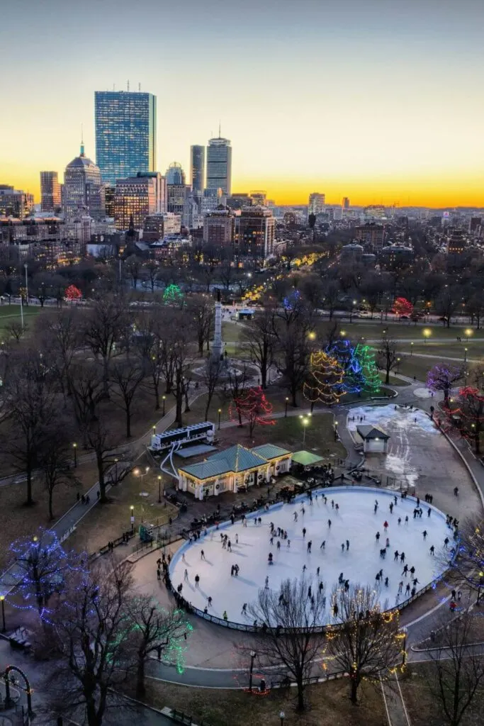 Aerial photo of the Boston Common Frog Pond ice skating rink during sunset.